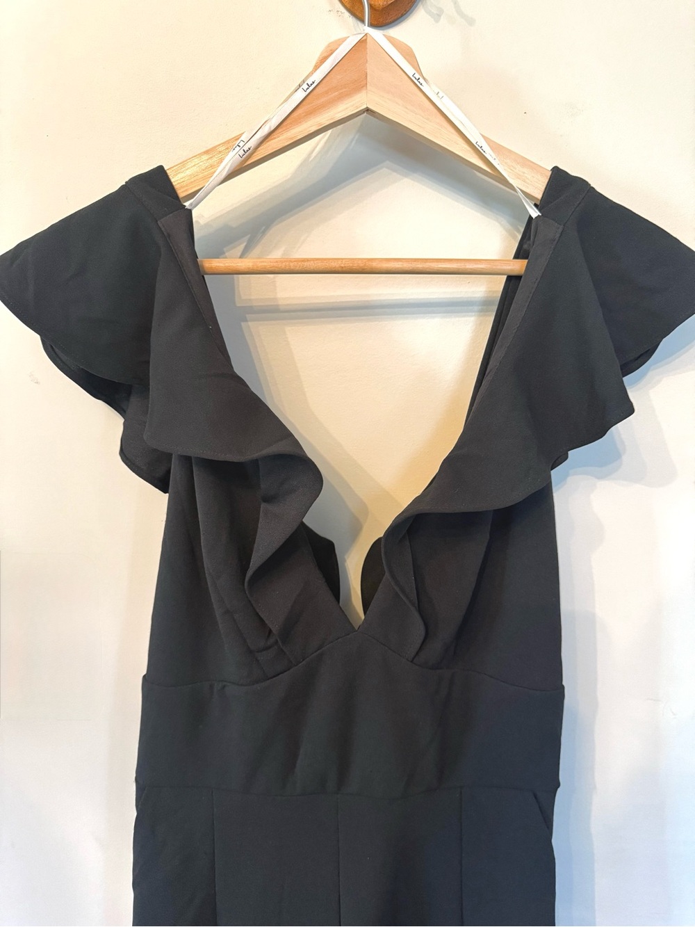 Lulu's Classic Black Jumpsuit with deep V and ruffle sleeves